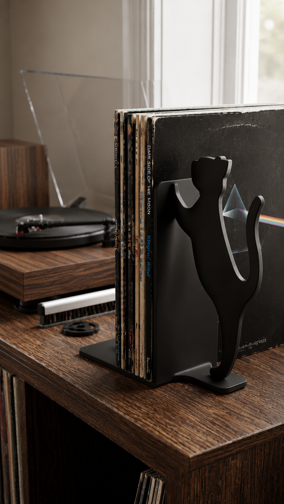 Black cat silhouette record bookend shown in a home audio setup.