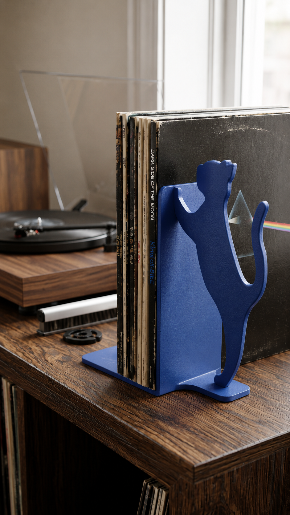 Blue cat silhouette bookend for vinyl record storage.