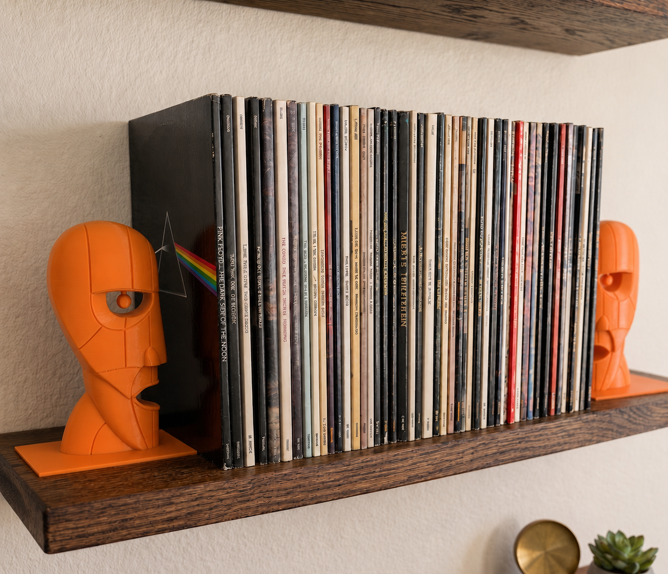 Orange Division Bell inspired 3D printed vinyl record bookends on a wooden shelf.