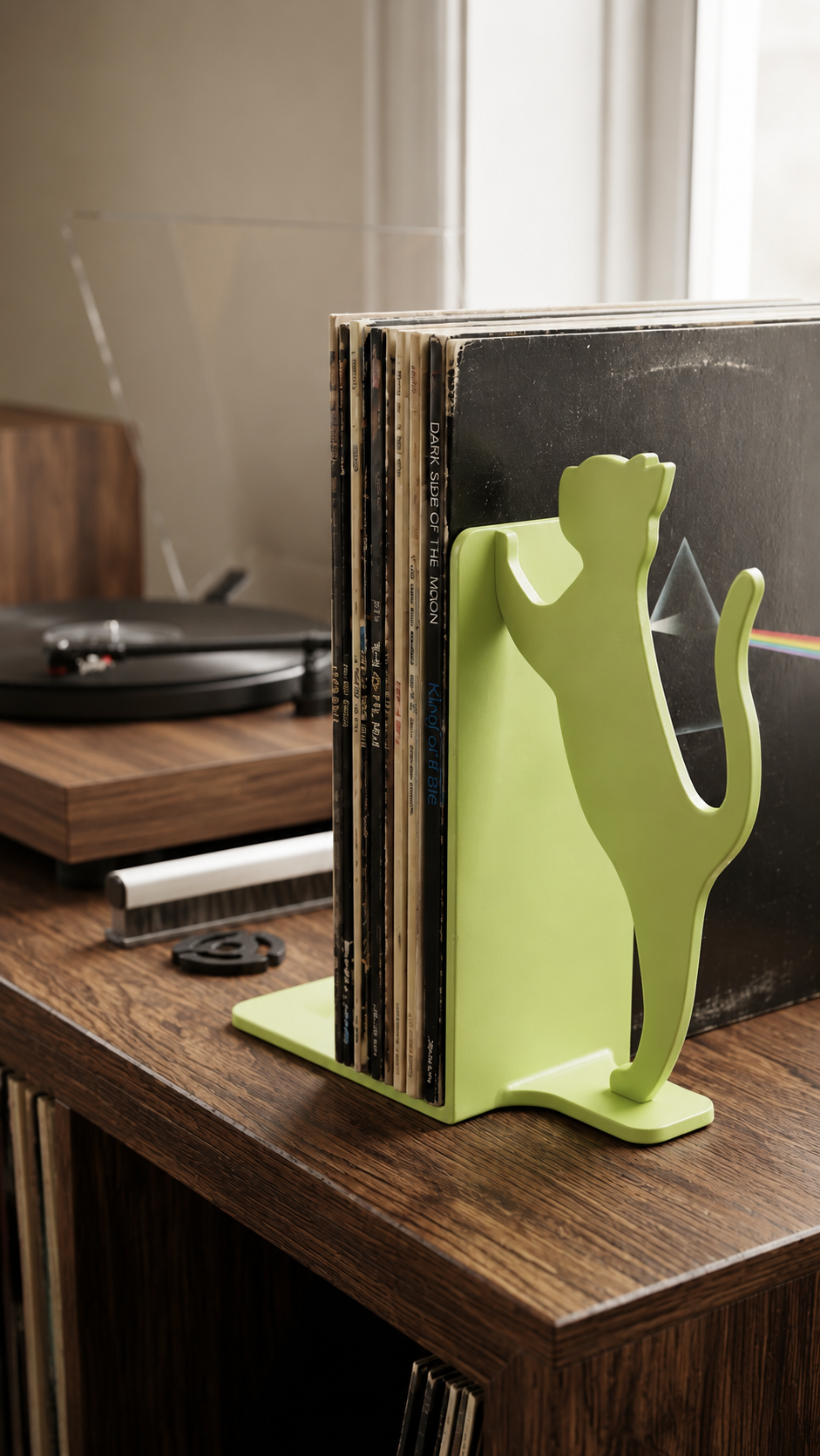 Lime green cat silhouette record bookend for vinyl storage.