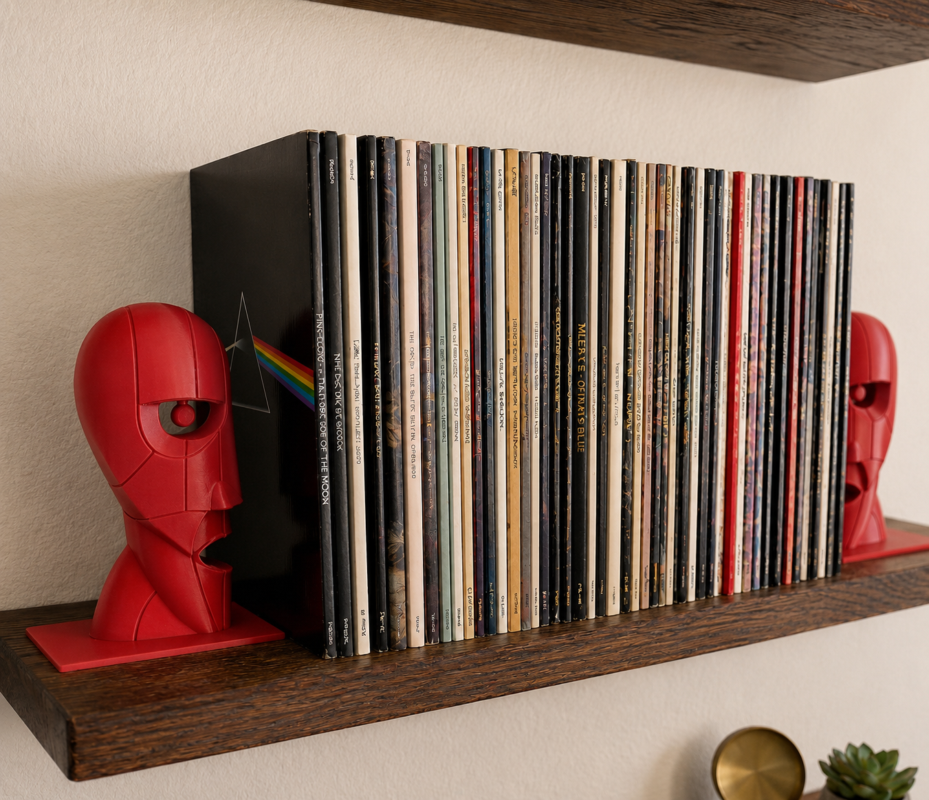 Red Division Bell inspired 3D printed vinyl record bookends on a wooden shelf.