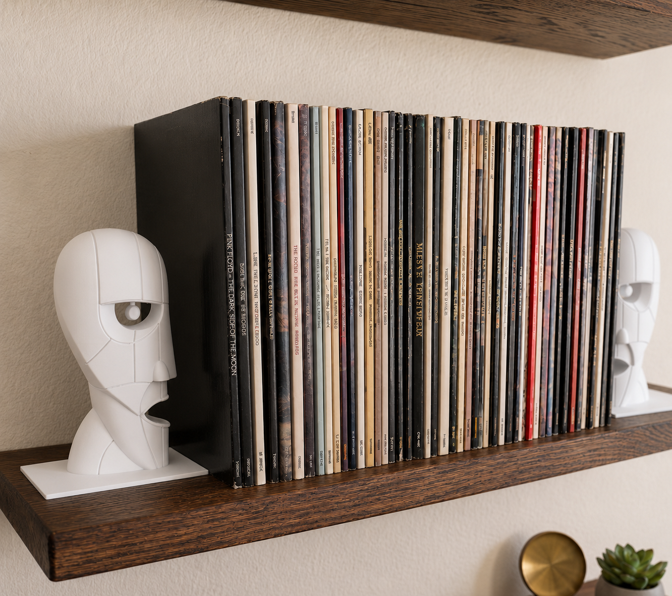 White Division Bell inspired 3D printed vinyl record bookends on a wooden shelf.