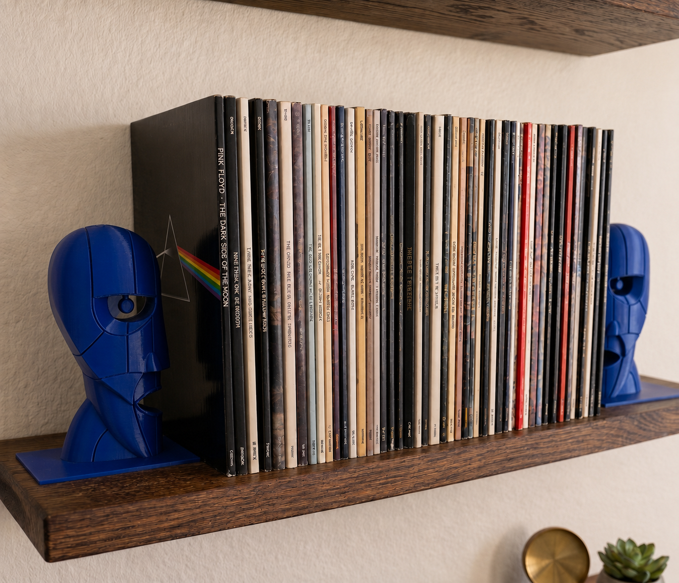 Blue Division Bell inspired 3D printed vinyl record bookends on a wooden shelf.